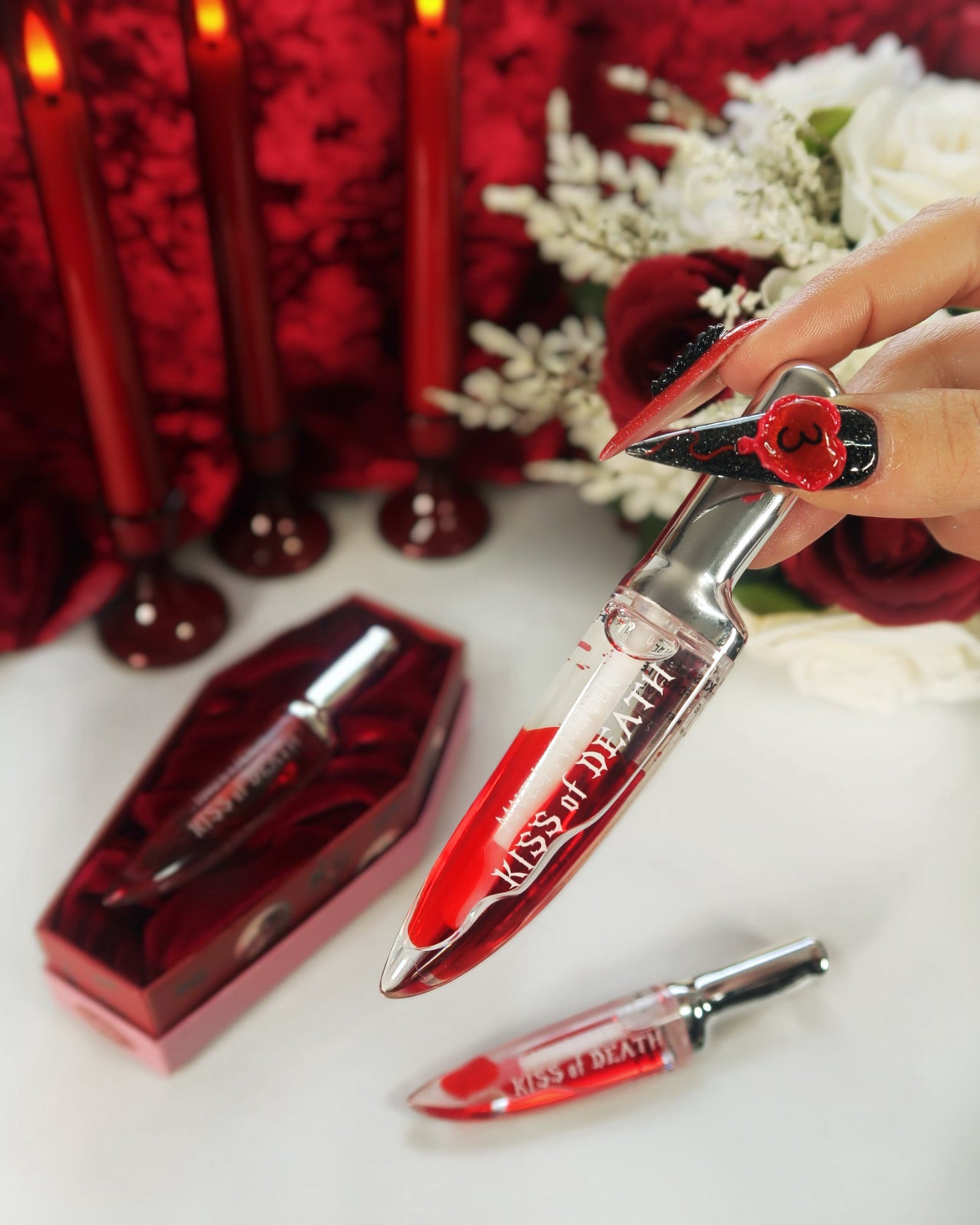 Red lip oil bloody gloss with coffin design 